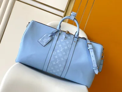 Keepall Bandoulière 50 Travel Bag in Taïga Leather and Monogram Canvas