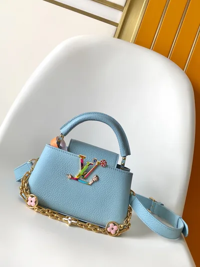 Capucines East West Mini Handbag in Light Blue Taurillon Leather