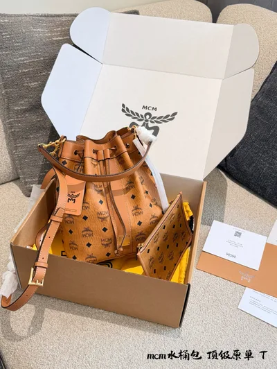 Cognac Drawstring Bucket Bag with Signature Print and Gold-Tone Hardware