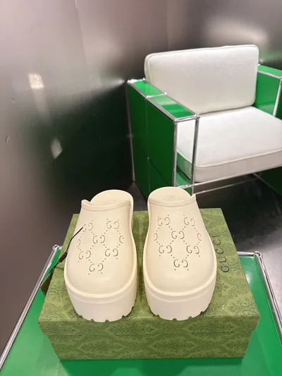 Gucci Perforated Carved Clogs